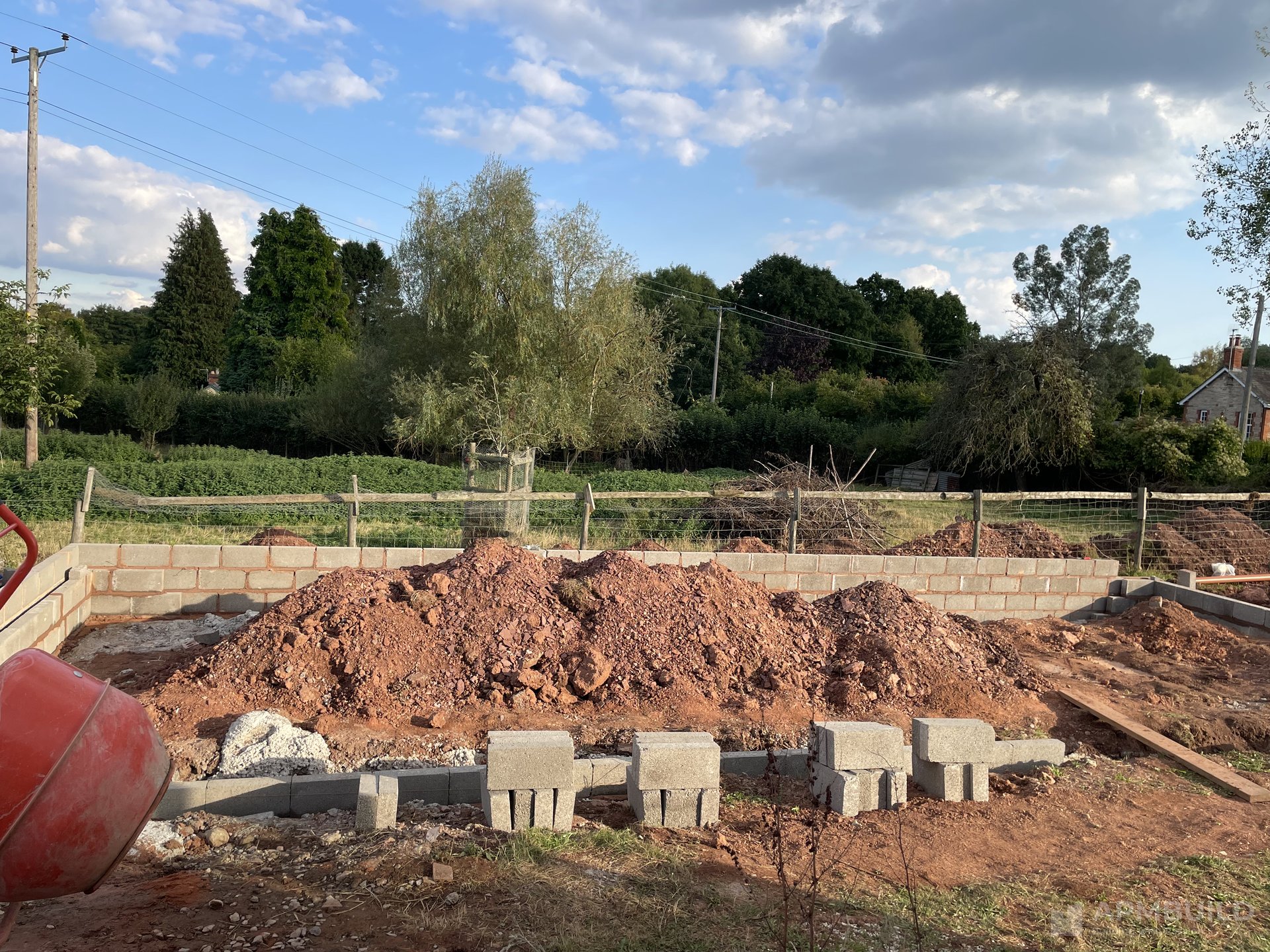 Completed garden-room with terracotta-tile roof and full glass elevation in Newent by APMBuild, Herefordshire