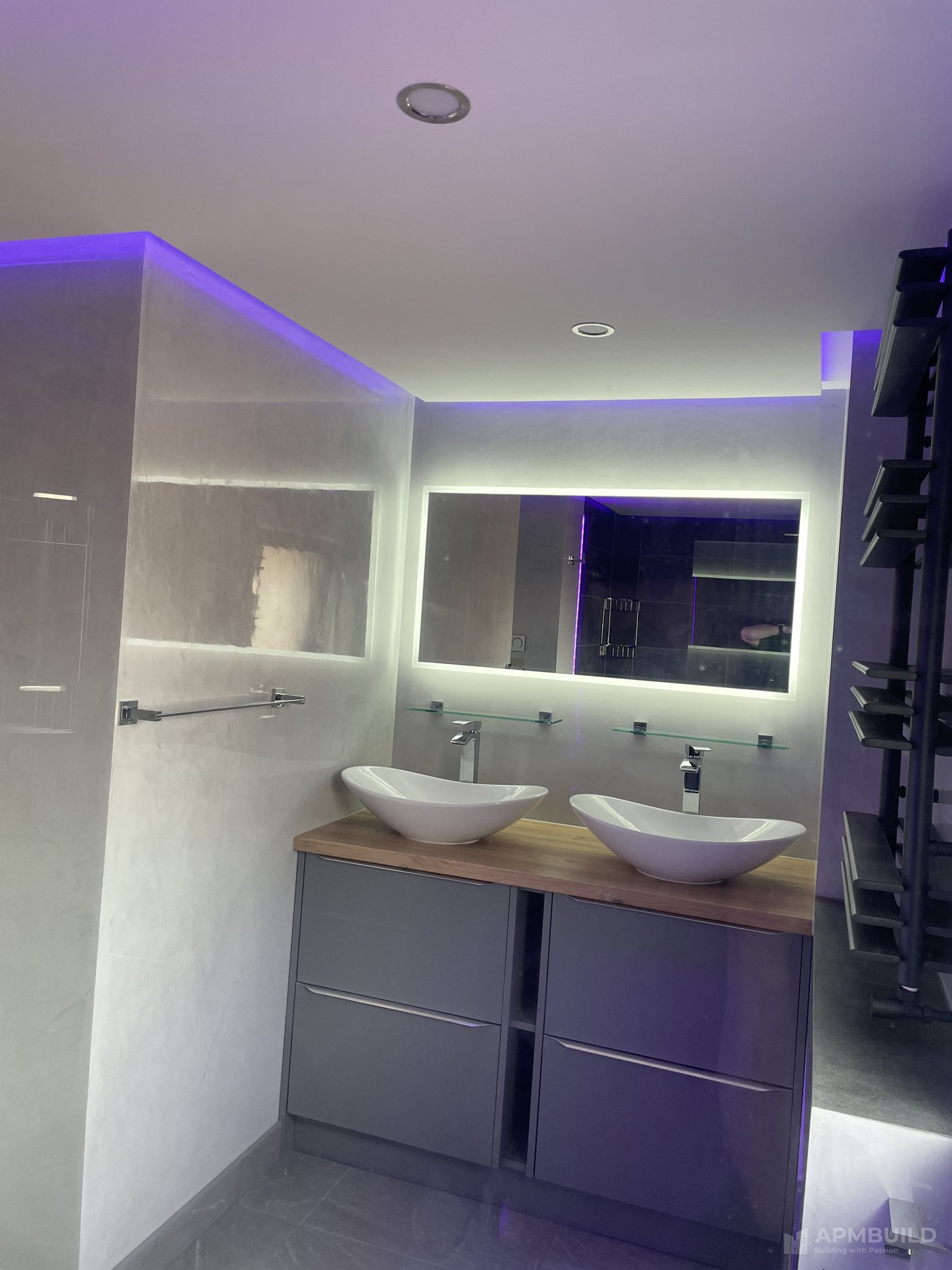 Finished walk-in shower with slate-effect porcelain and purple LED cove in Saxon Gate Hereford by APMBuild